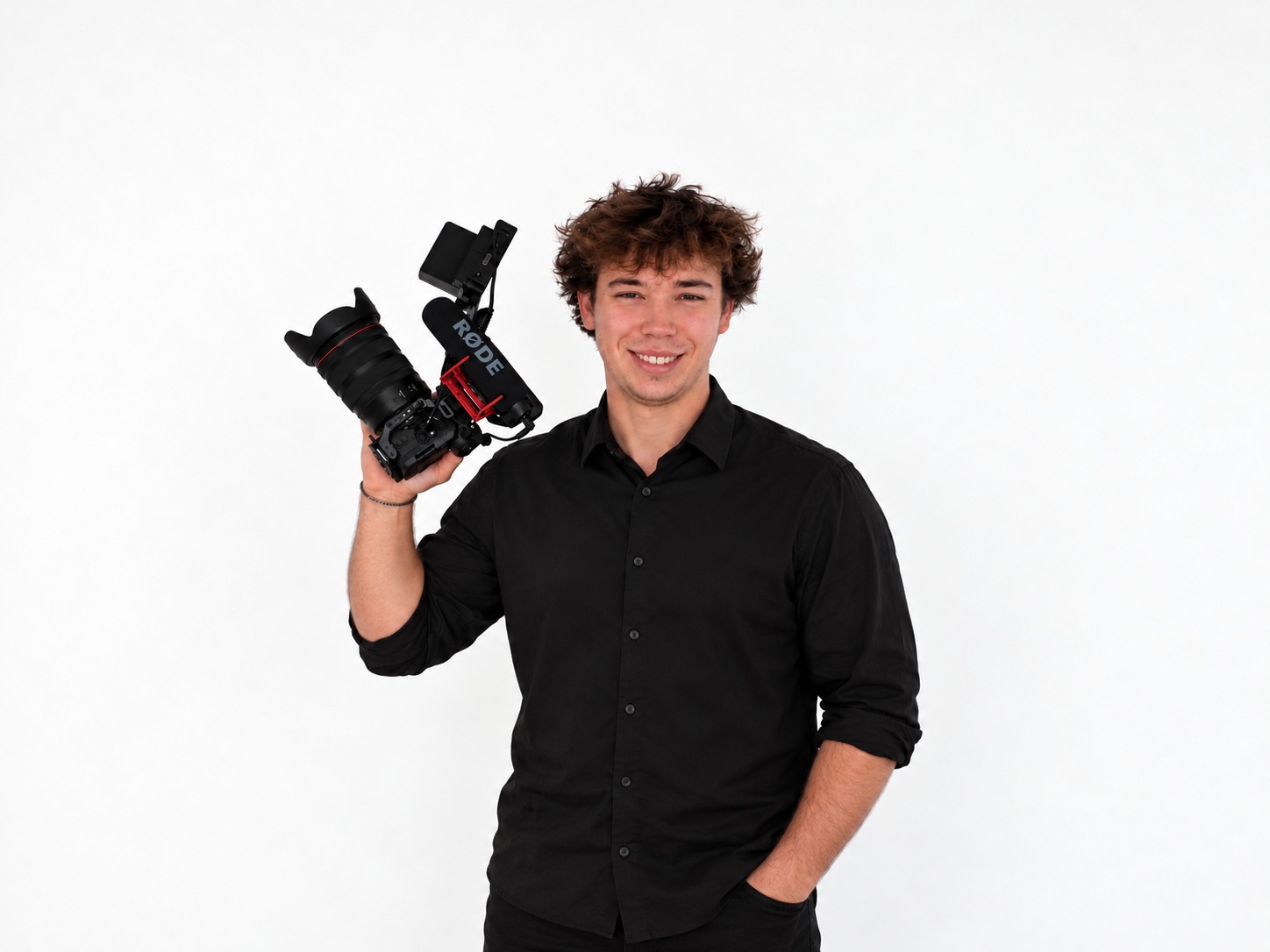 Easton Withers, Easton Visuals wedding videographer in Springfield, Missouri, holding his camera